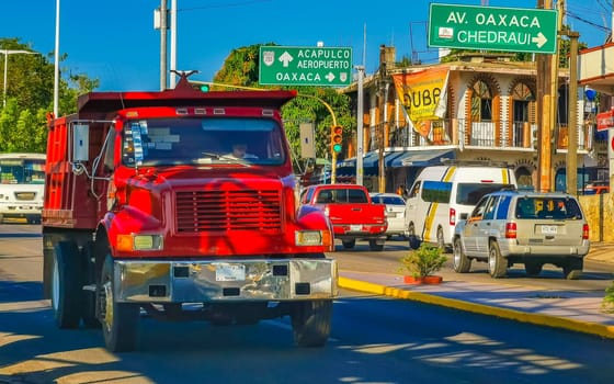 Mexican tipper dumper dump trucks truck cargo transporter delivery cars car vehicles in Puerto Escondido Zicatela Oaxaca Mexico.