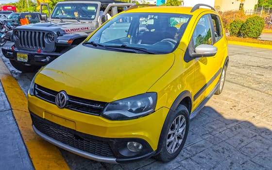 Yellow car vehicle transportation modern in the city town in Zicatela Puerto Escondido Oaxaca Mexico.