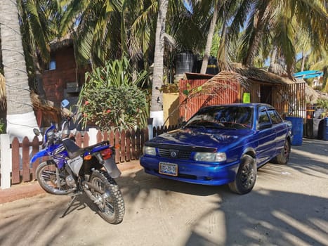 Dark black blue car vehicle transportation in the city town in Zicatela Puerto Escondido Oaxaca Mexico.