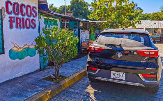 Dark black blue car vehicle transportation in the city town in Zicatela Puerto Escondido Oaxaca Mexico.