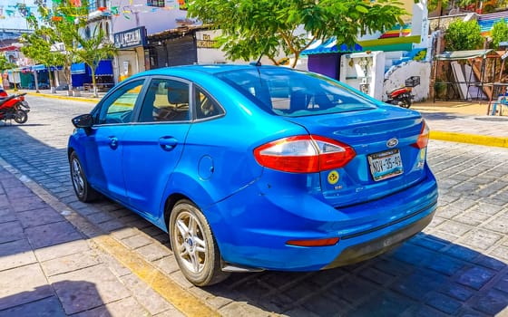 Dark black blue car vehicle transportation in the city town in Zicatela Puerto Escondido Oaxaca Mexico.