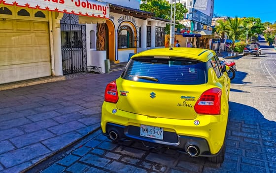 Yellow car vehicle transportation modern in the city town in Zicatela Puerto Escondido Oaxaca Mexico.