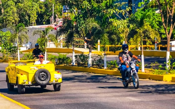 Yellow car vehicle transportation modern retro in the city town in Zicatela Puerto Escondido Oaxaca Mexico.