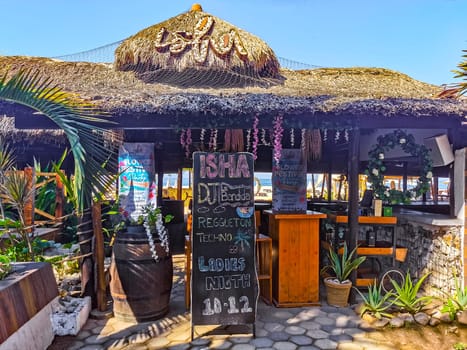 Restaurant restaurants bar bars shops hotels palms palm trees and promenades on the beach in Zicatela Puerto Escondido Oaxaca Mexico.