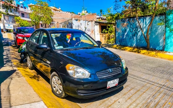 Dark black blue car vehicle transportation in the city town in Zicatela Puerto Escondido Oaxaca Mexico.