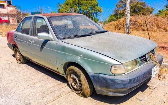 White silver gray grey car vehicle transportation in the city town in Zicatela Puerto Escondido Oaxaca Mexico.