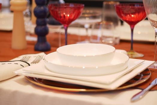 round bowl or ceramic plate on napkin on wooden table