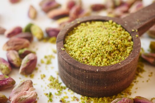 Wooden bowl filled with pistachios, a natural and nutritious superfood.