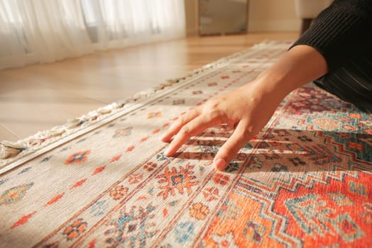 hand touching new home carpet .