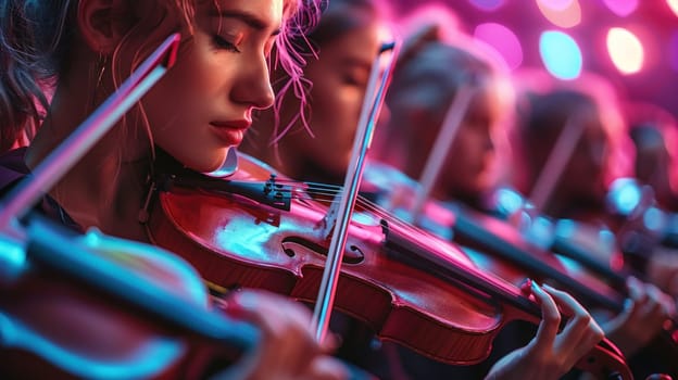 A group of women playing violins in a concert.