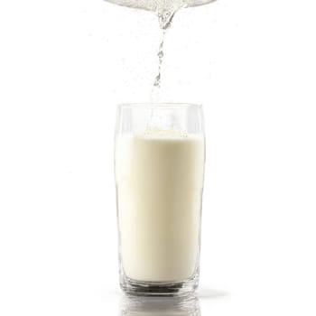 Kefir in glass with pouring motion and bubbles rising to surface Food and culinary concept. Food isolated on transparent background.