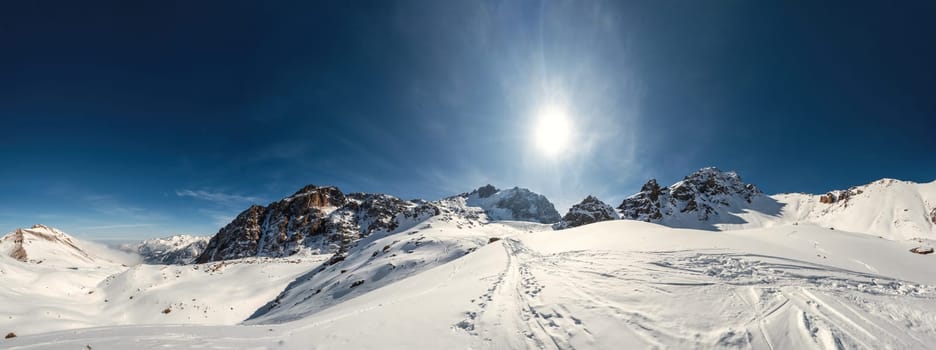 Panorama of scenic amazing high-altitude mountain views of Central Asia. Tour to the winter mountains of the Tien Shan, a national natural park in the Almaty Mountains of Kazakhstan.