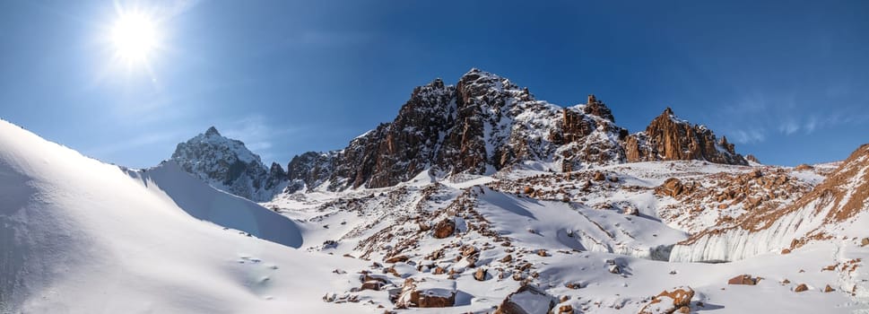 Panorama of picturesque high altitude mountain views of Central Asia. Tour to the Tian Shan Mountains, in the Almaty Mountains of Kazakhstan.