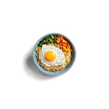 Quinoa breakfast bowl fluffy quinoa topped with sauteed veggies a fried egg. Food isolated on transparent background.