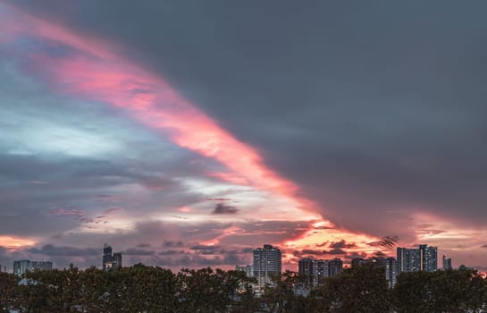 Bangkok, Thailand - May 20, 2024 - Gorgeous scenic of sunset with beautiful cloud and sky over metropolitan city. Bangkok city skyscrapers after sunset with Beautiful sky background, They can be used as Wallpaper, Copy space, Selective Focus.