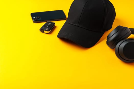 Baseball hat against yellow background in studio close up