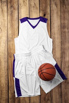 Basketball uniform on wooden background top view flat lay