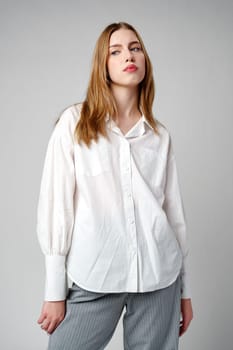 Young Woman Exhibiting a Pensive Sad Expression in a Studio close up