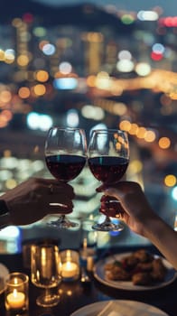 couple toasting wine glasses in a romantic dinner with city night skyline in the background.