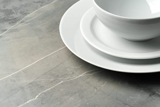 Elegant table setting on grey marble background, flat lay