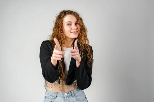 Woman in Black Jacket Pointing at You in Studio