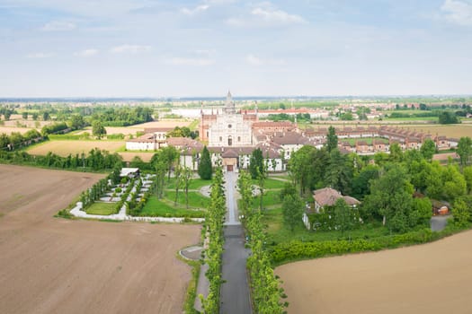 Aerial shot of Certosa di Pavia cathedral a historical monumental complex that includes a monastery and a sanctuary. Pavia ,Italy.