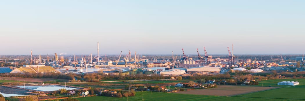 Aerial view of the industrial and port area of Ravenna ,chemical and petrochemical pole,thermoelectric,metallurgical plants and hydrocarbon refinery and liquefied natural gas tanks