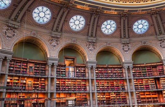 PARIS, FRANCE, OCTOBER 20, 2022 : Oval reading room in National Library, Richelieu site, Paris, france, built by architects Jean-Louis Pascal. and Alfred Recoura, from year 1897 to year 1932