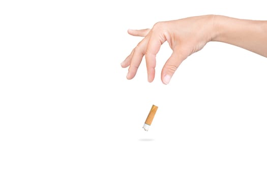 female hand throwing a cigarette on isolated white background.