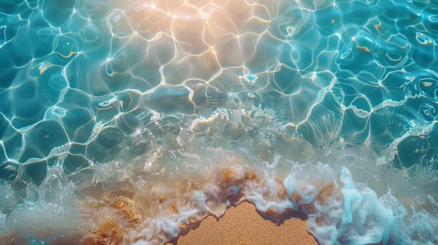 View from above of the crystal clear water along the shoreline with rocky seabed.