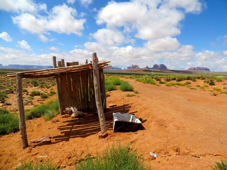 Dirt Road with Wood Shelter and Bathtub in Desert Southwest near Monument Valley. High quality photo