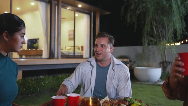 Family gather for holiday celebration. Focus romantic couple and old grandfather together eat dinner party. Outdoor activity for spending time with lovely relatives cross generation gap. Divergence.