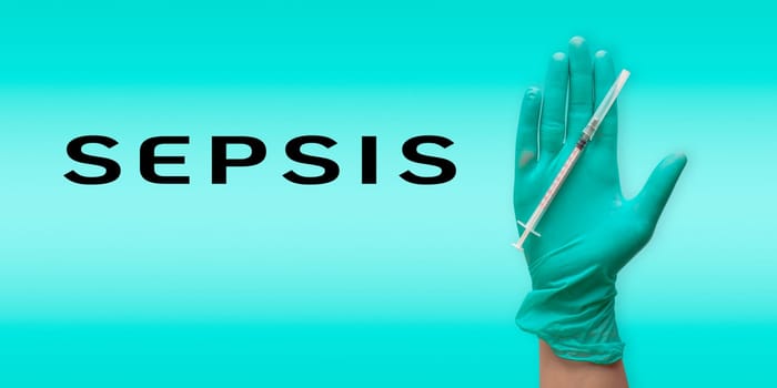 A hand holding a syringe with the word sepsis written below it. Concept of urgency and importance, as sepsis is a serious medical condition that requires immediate treatment