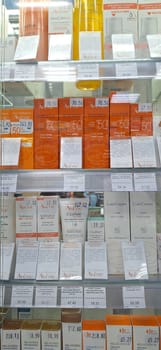 Bobruisk, Belarus - May 1, 2024: A selection of Avene sunscreens, hand creams, and skincare products neatly arranged on pharmacy shelves.