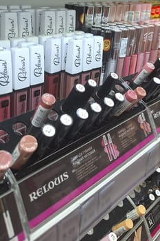 Bobruisk, Belarus - May 1, 2024: A display shelf in a store is filled with numerous lipstick products Relouis in different colors and brands.