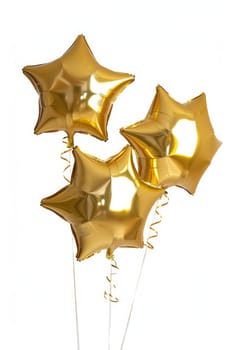 A bunch of shiny golden star-shaped balloons with festive ribbons on a white background