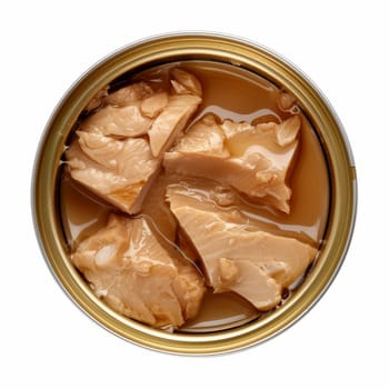 Overhead view of an open can showing chunks of tuna fish preserved in oil, set against a clean white background.