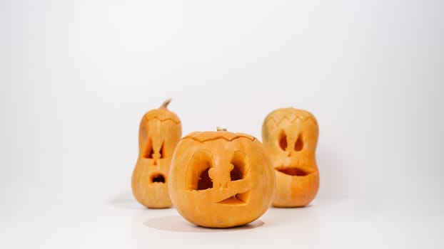 Three jack-o-lantern on a white background. Halloween decoration