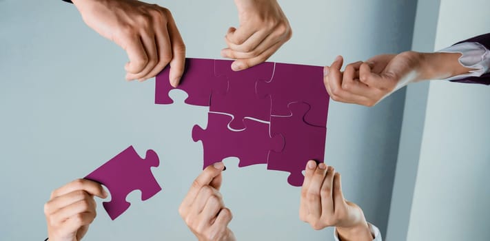 Top view panorama banner of business team assembling jigsaw puzzle over table symbolize business partnership and collective teamwork for HR recruitment and job seeker background. Shrewd