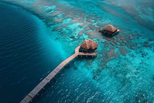 Two huts built on stilts in the water, surrounded by a serene landscape.