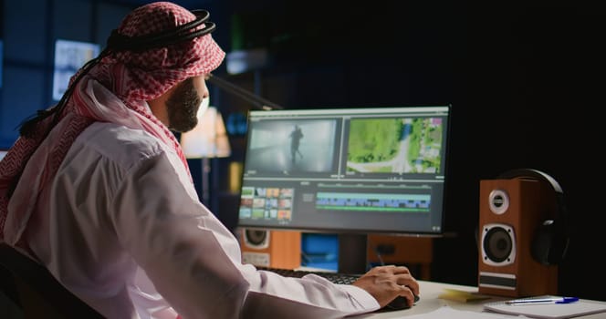 Arabic colorist freelancer editing outsourcing cinematographic project, creating content creation stock footage, working with images and sounds. Teleworking worker processing movie on PC workstation