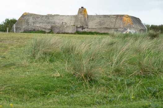 Normandy France D-Day stronghold bunker at top of hill in Utah beach area. WWII Utah Beach. Veterans Day rememberance. High quality photograph