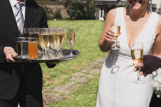 Waiter serving champagne at a wedding