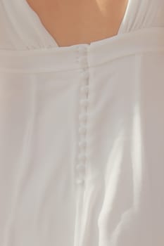 Buttons on the open back of a wedding dress