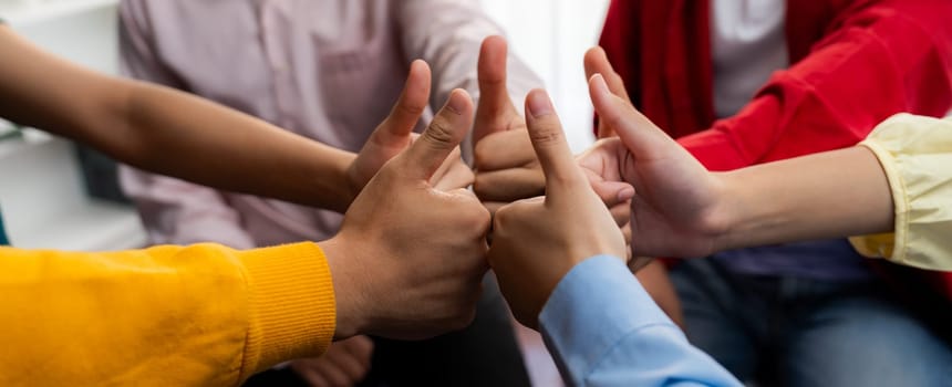 Startup company employee team stacking hand together symbolize successful group of business partnership and strong collective unity teamwork in community workplace in panoramic banner. Synergic