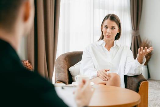 Psychological consultation gaining improvement on mental problem, happy young female patient doing therapy session while psychiatrist making diagnostic on mental illness. Unveiling