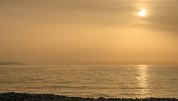 Golden hour shot of the sun setting over the Mediterranean Sea 1