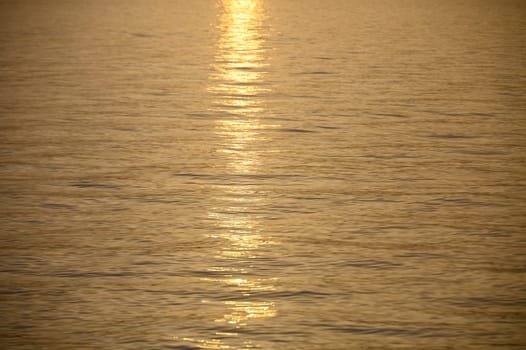 View of a calm sea against a clear sky during sunset