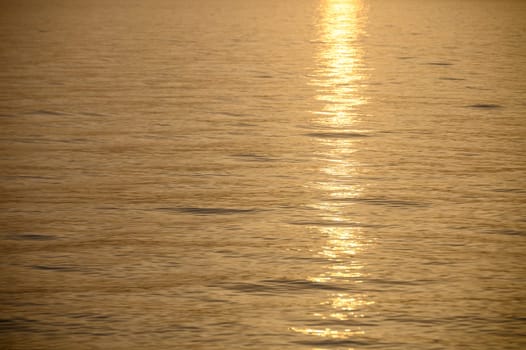 View of a calm sea against a clear sky during sunset 1