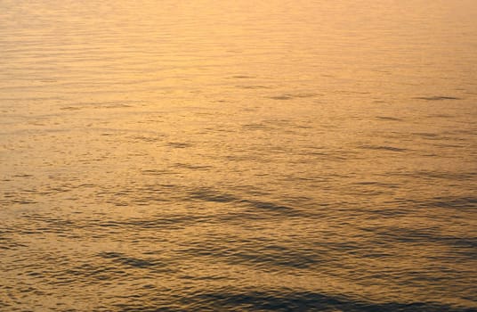 Mediterranean sea waves of golden color at sunset. water background 1